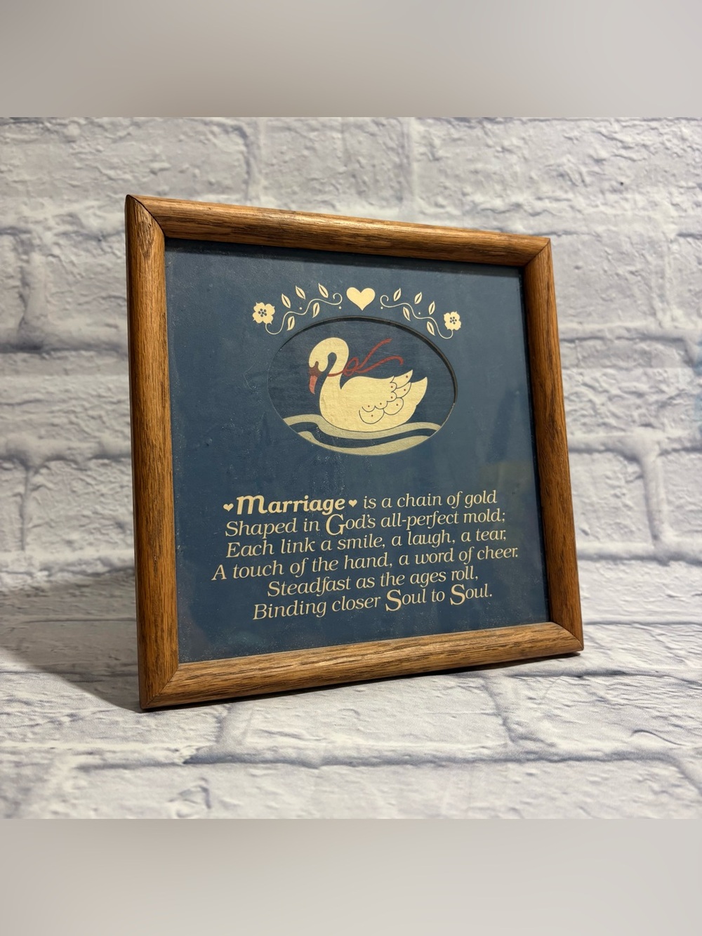 Vintage wooden framed illustrated swan “Marriage Is A Gold Chain” wall decor